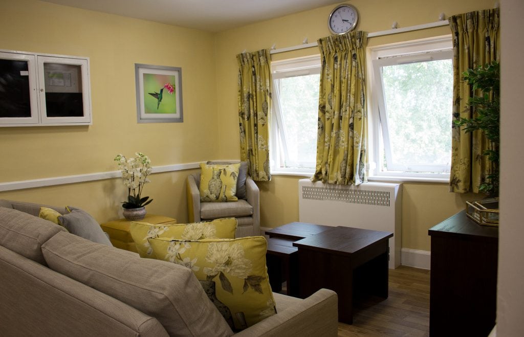 yellow lounge with  soft furnishings