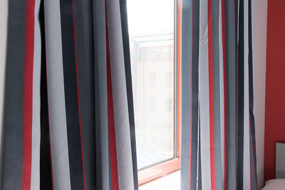 Striped curtains hung at a window