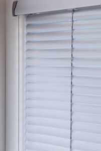 A venetian blind with white slats