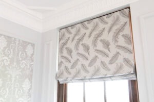 A roman blind with feather pattern